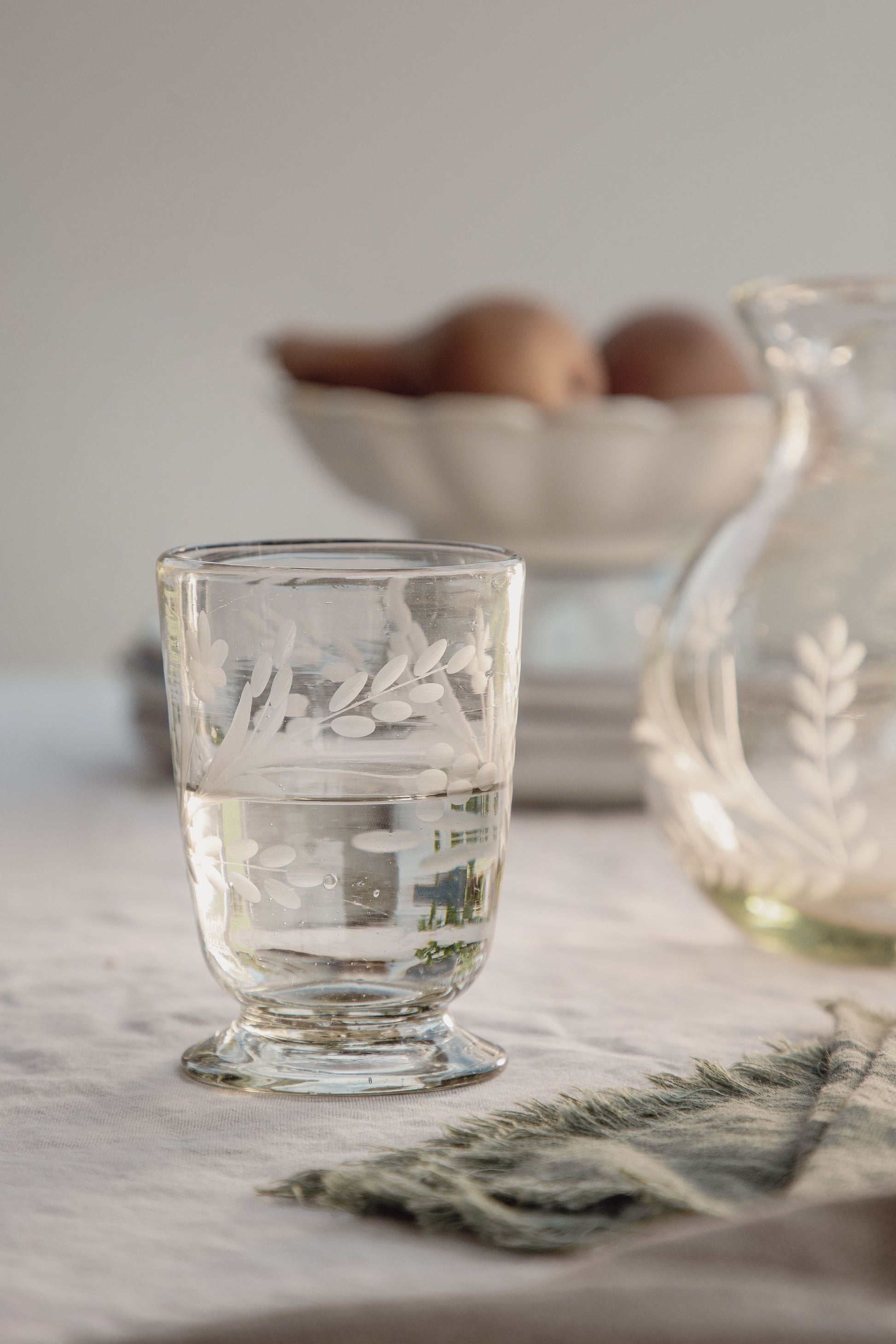 handblown from recycled glass and hand-etched with a floral design