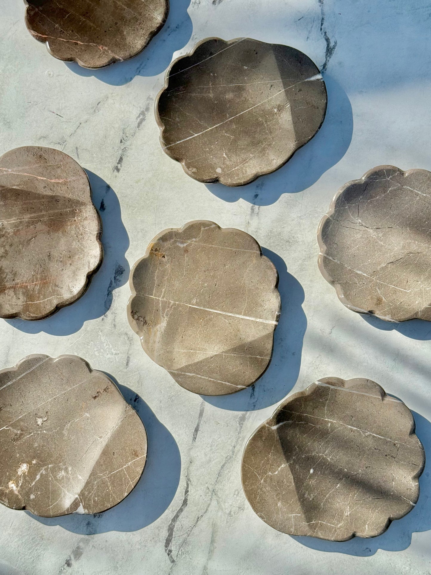 Gray marble spoon rest styled on a kitchen counter, adding natural texture and timeless elegance