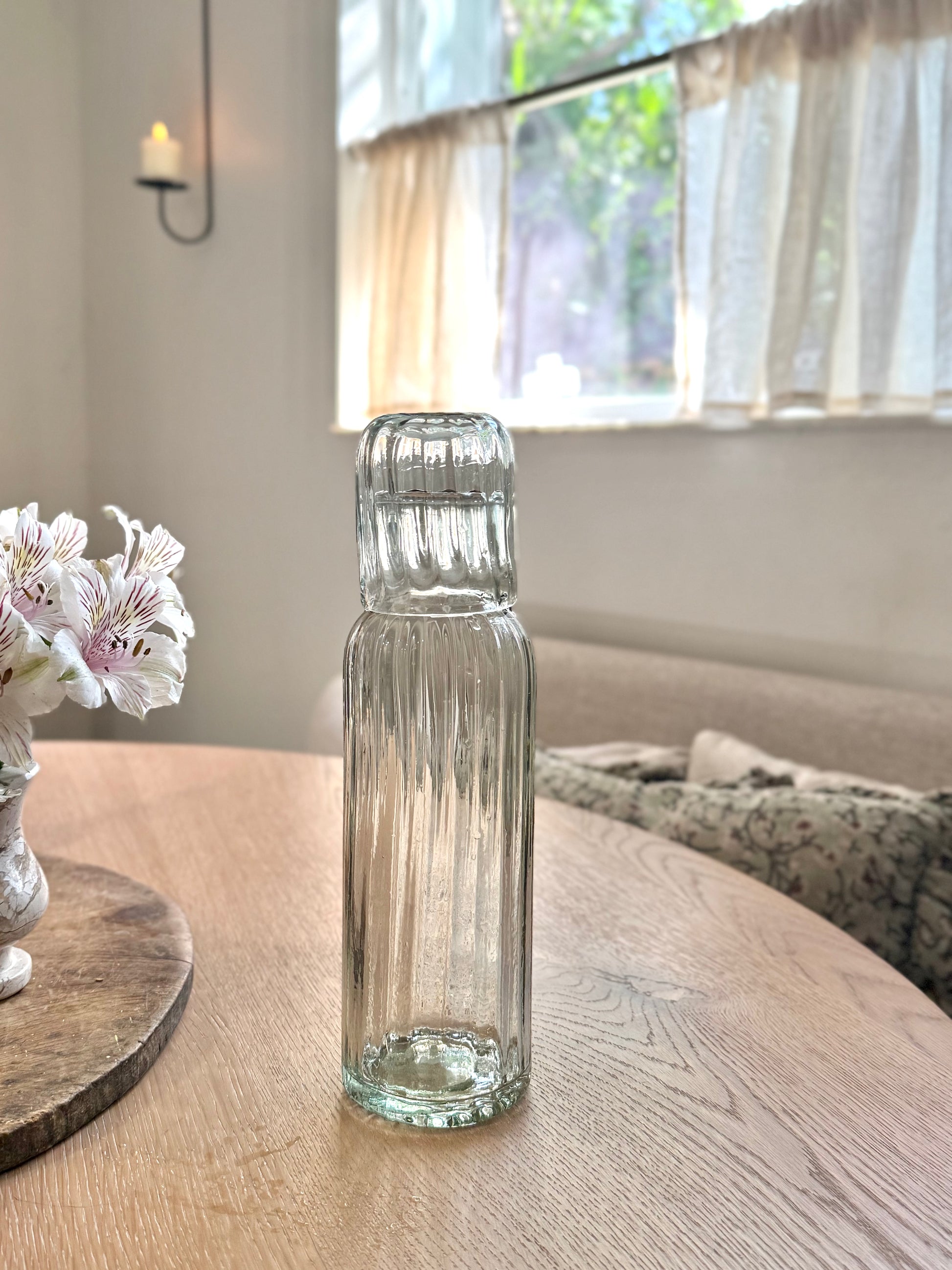 Handblown fluted tall carafe set made from recycled glass, handcrafted in Mexico with unique artisan variations