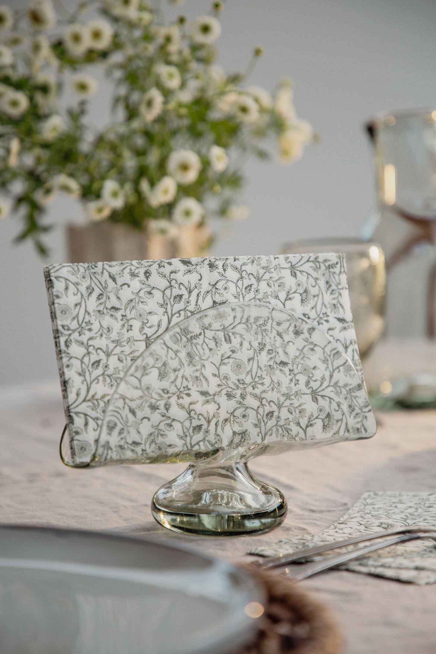 Handblown napkin holder made from recycled glass with artisan variations in shape and texture