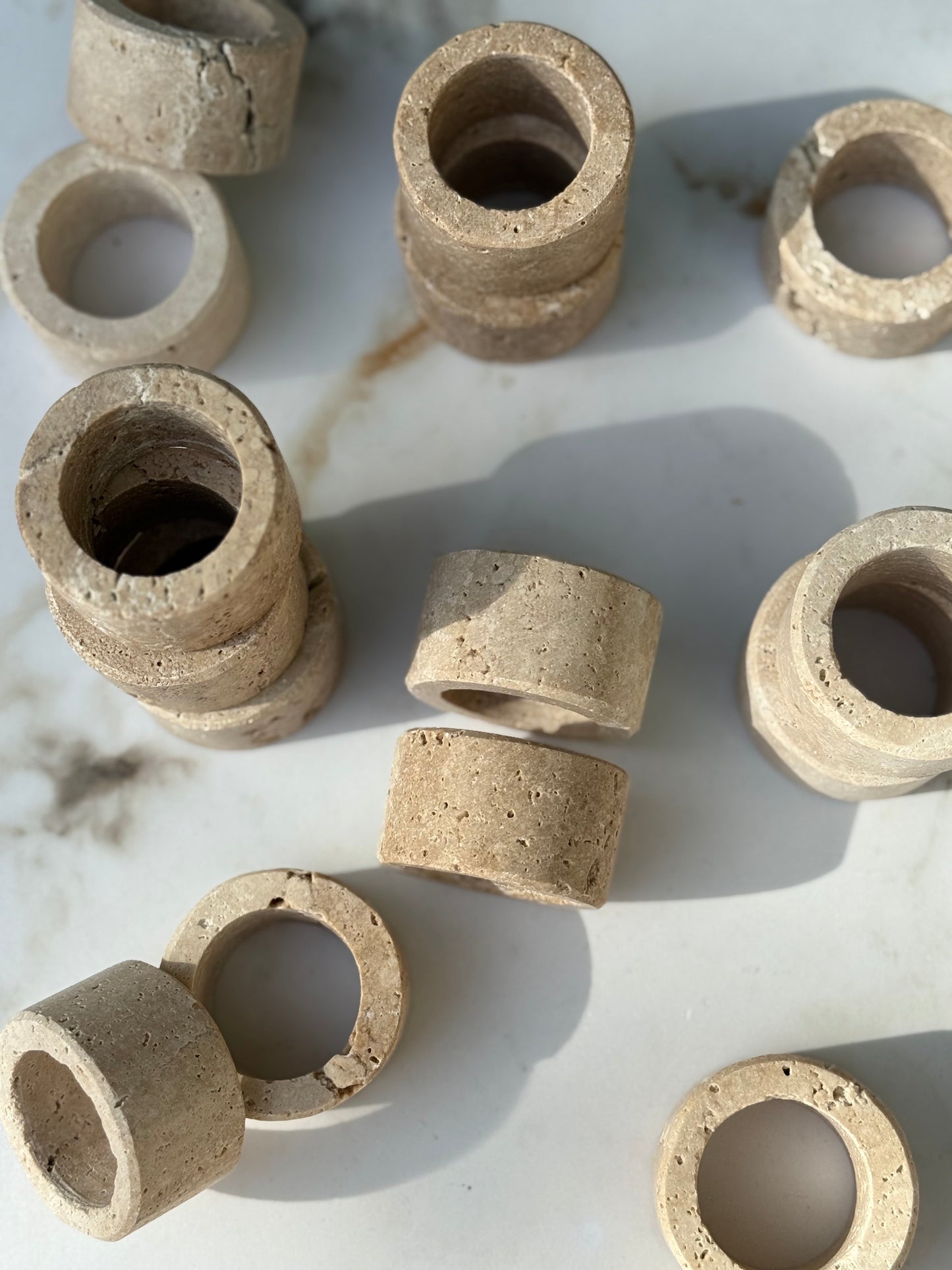 Handcrafted travertine stone napkin ring with natural texture and timeless design